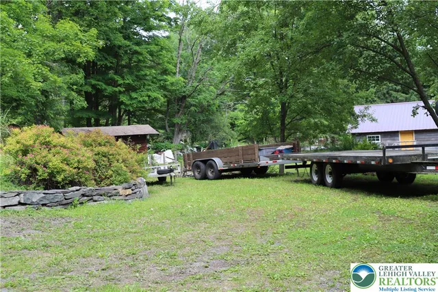 a backyard of a house with seating space