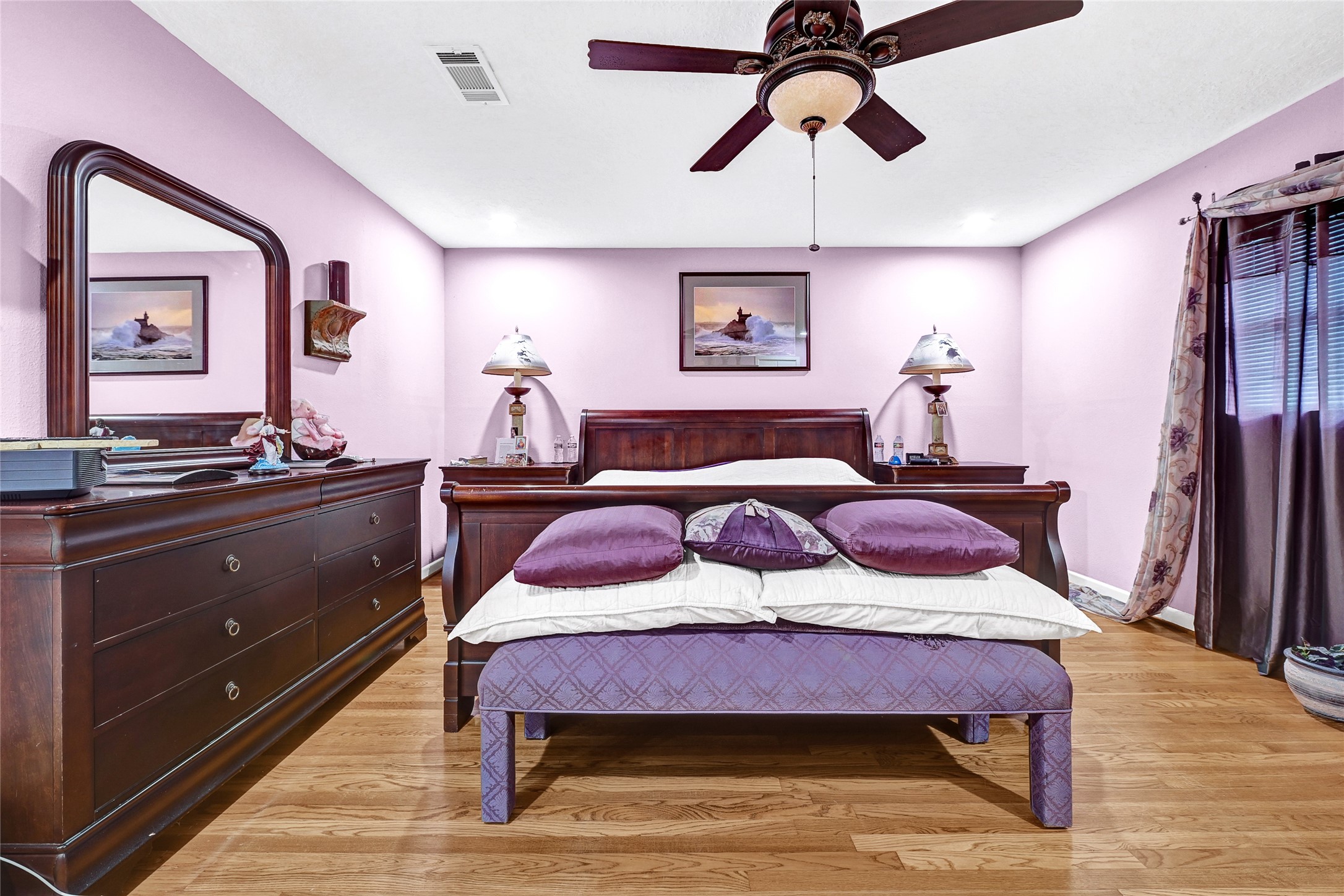 4831 Knickerbocker Street Houston, TX 77035 - Photo 43 of 50 showing the full bed frame, overhead fan, and coordinating decor.