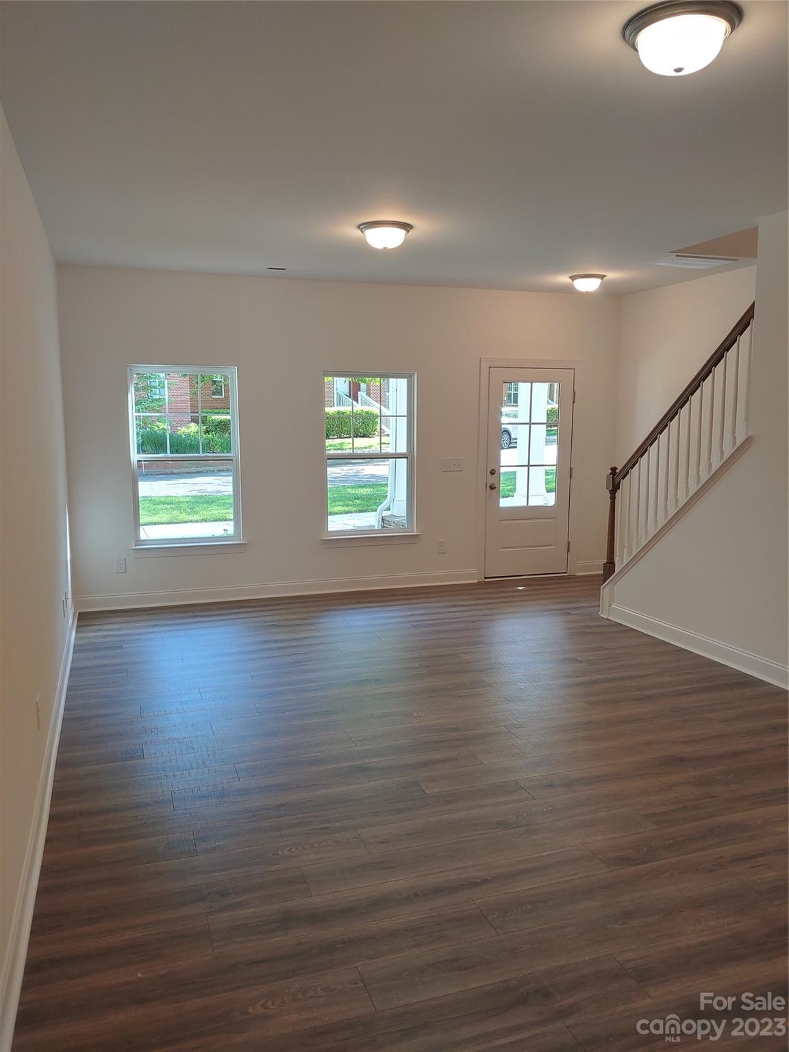 1805 Edgewater Drive Northwest Conover, NC 28613 - Photo 5 of 17 a view of an empty room with wooden floor and a window