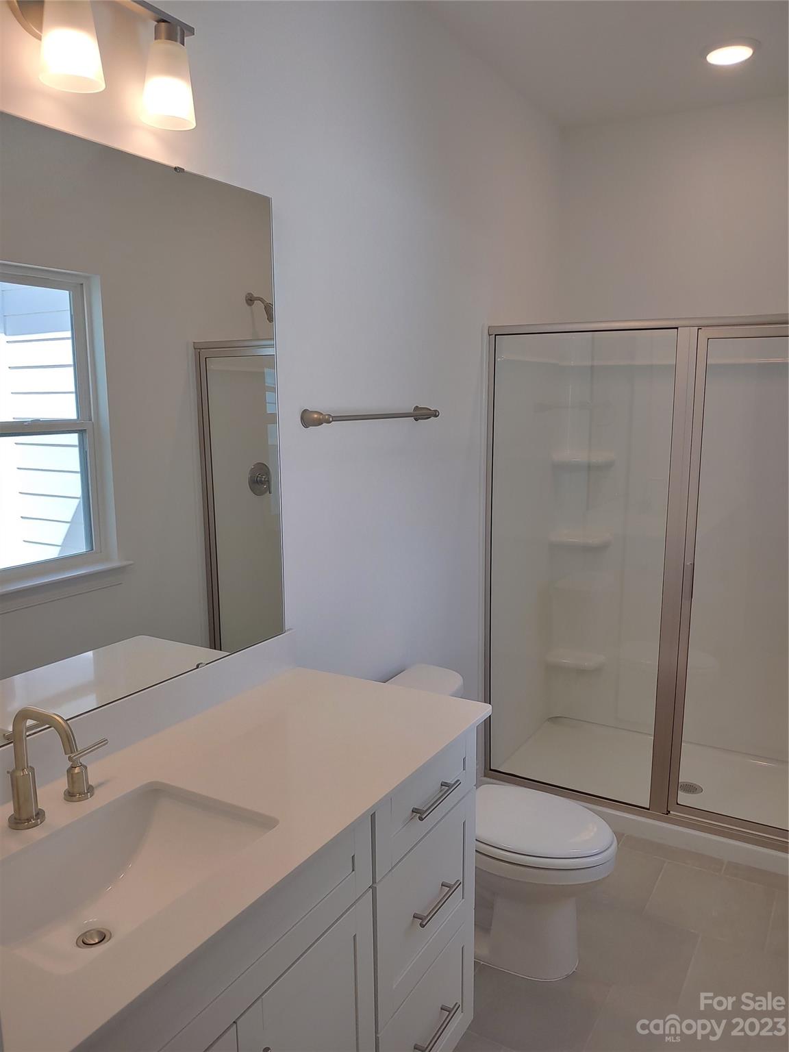 1805 Edgewater Drive Northwest Conover, NC 28613 - Photo 10 of 17 a bathroom with a sink a toilet and shower