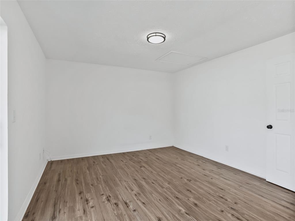 5911 Northwest 9th Street Ocala, FL 34482 - Photo 17 of 37 a view of a room with wooden floor