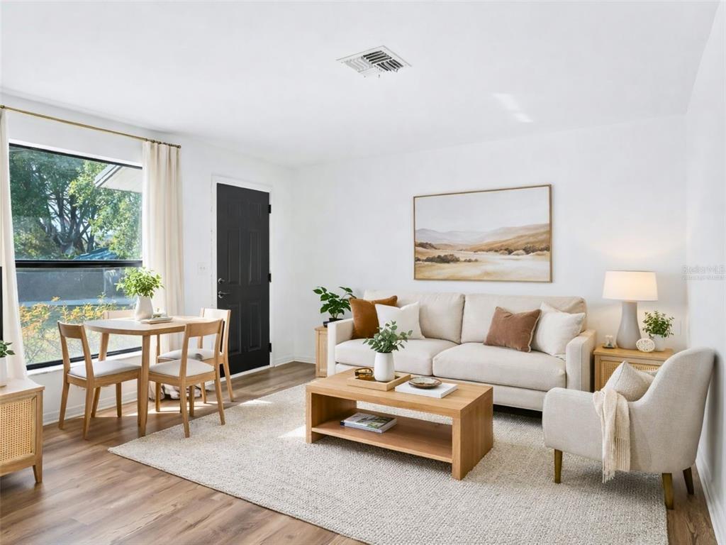 5911 Northwest 9th Street Ocala, FL 34482 - Photo 22 of 37 a living room with furniture and a large window