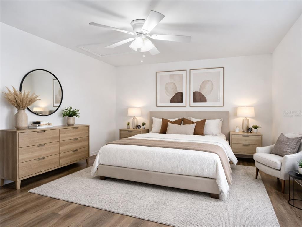 5911 Northwest 9th Street Ocala, FL 34482 - Photo 29 of 37 a bedroom with a bed and a chandelier