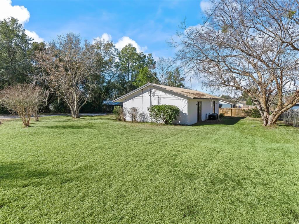 5911 Northwest 9th Street Ocala, FL 34482 - Photo 3 of 37 a house view with garden space