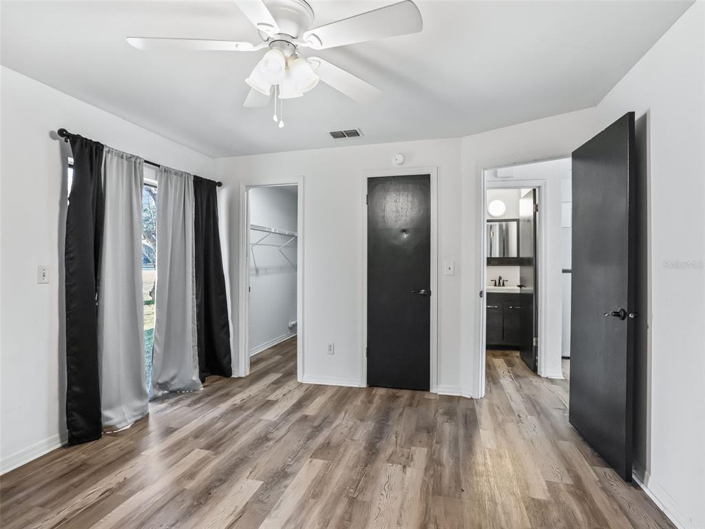 5911 Northwest 9th Street Ocala, FL 34482 - Photo 32 of 37 a view of a room with a hallway and wooden floor
