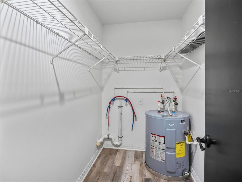 5911 Northwest 9th Street Ocala, FL 34482 - Photo 33 of 37 a view of storage and utility room with racks on the wall
