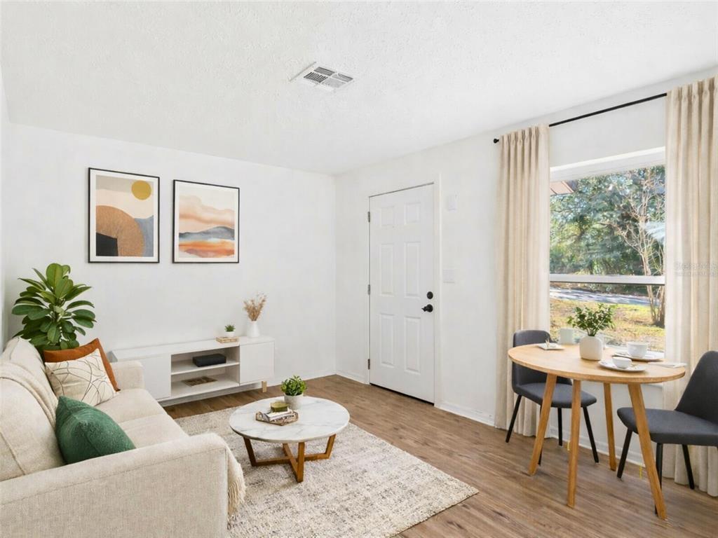 5911 Northwest 9th Street Ocala, FL 34482 - Photo 7 of 37 a living room with furniture and wooden floor