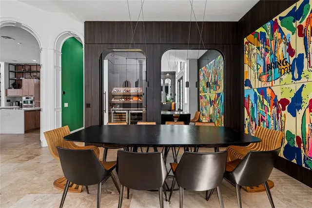 a living room with furniture a rug and a painting on the wall