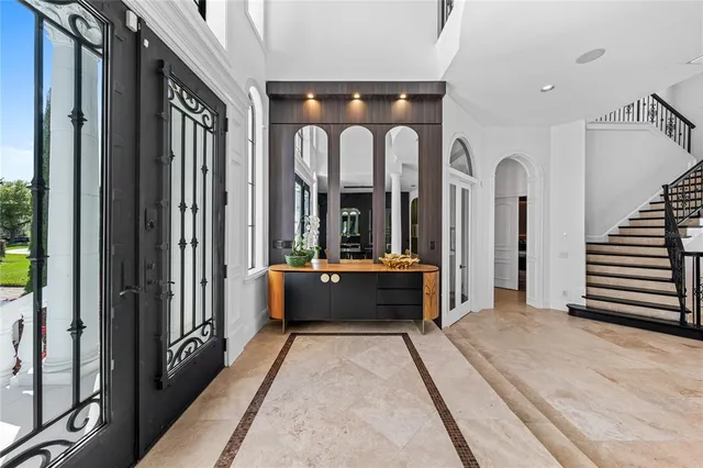 a room that has a bed and a table in it