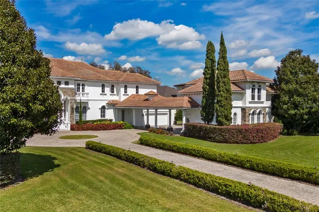 an aerial view of a house with yard swimming pool and outdoor seating