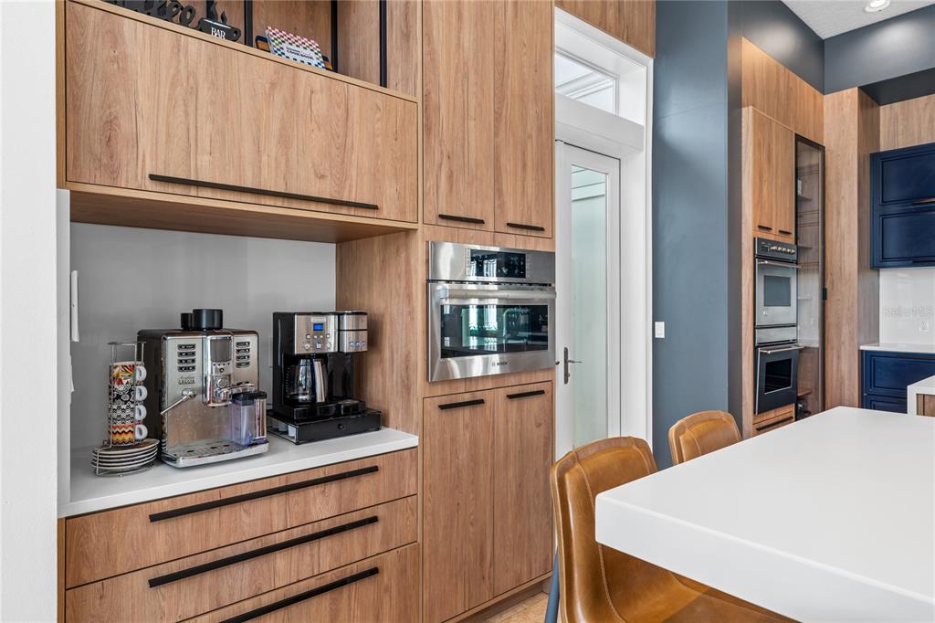 9343 Tibet Pointe Circle Windermere, FL 34786 - Photo 34 of 98 a kitchen with stainless steel appliances granite countertop a refrigerator and microwave