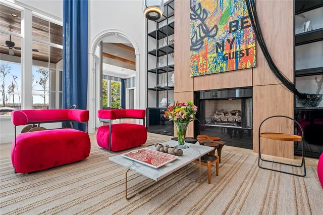 a living room filled with furniture and a potted plant