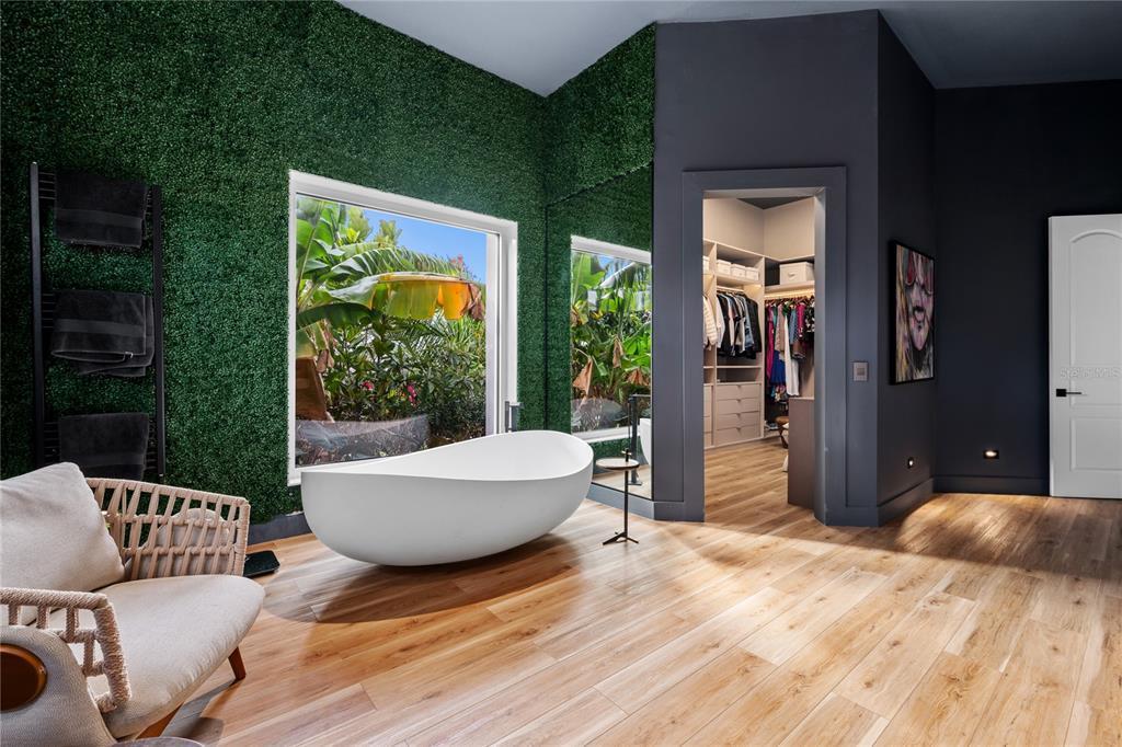 9343 Tibet Pointe Circle Windermere, FL 34786 - Photo 62 of 98 a living room with furniture and a large window