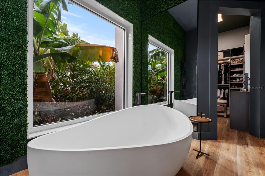 9343 Tibet Pointe Circle Windermere, FL 34786 - Photo 63 of 98 a white bath tub sitting in front of a window