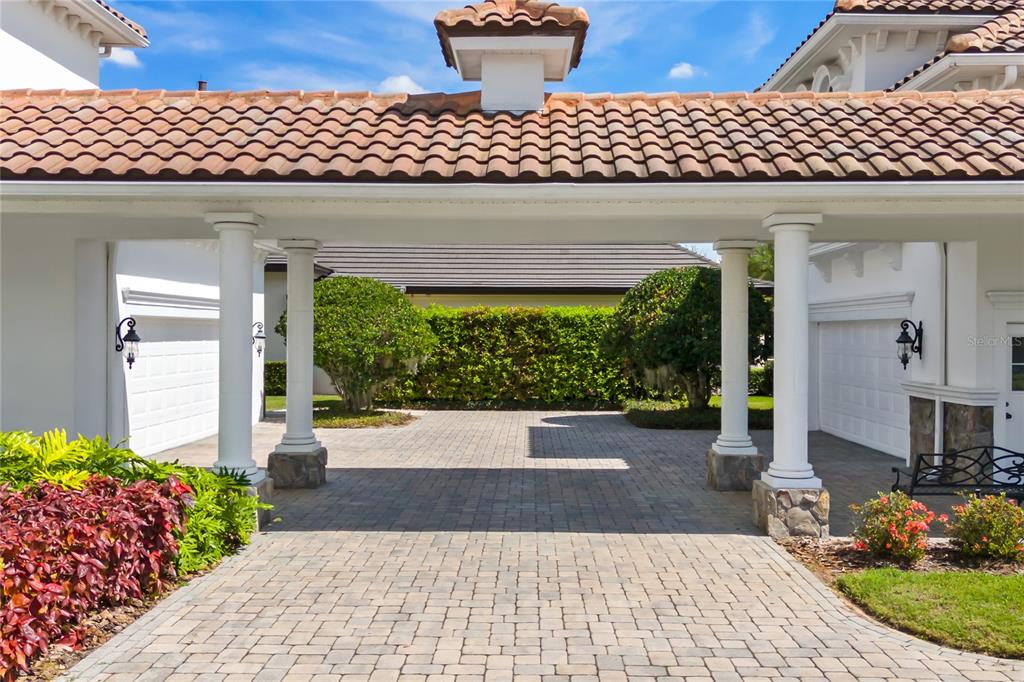 9343 Tibet Pointe Circle Windermere, FL 34786 - Photo 10 of 98 a front view of a house with garden