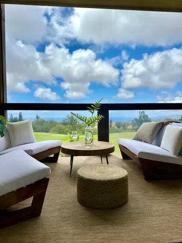 a view of a swimming pool with a couches in a patio