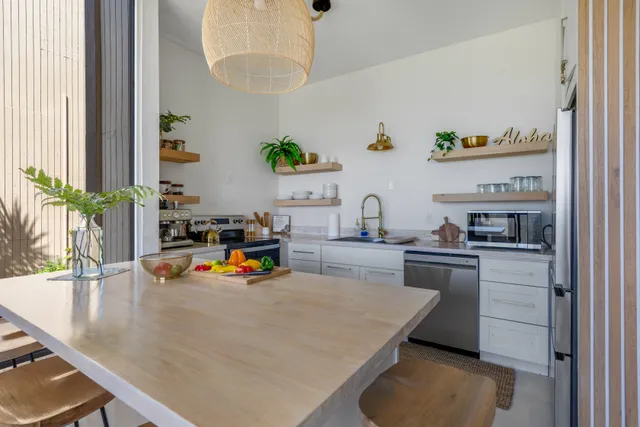 a kitchen with a sink and a large window