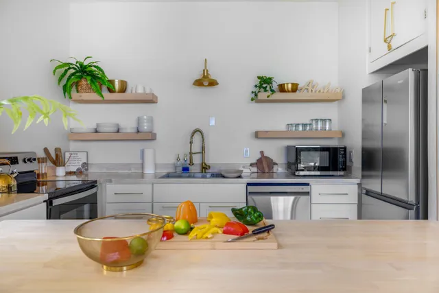 a kitchen with a refrigerator and a sink