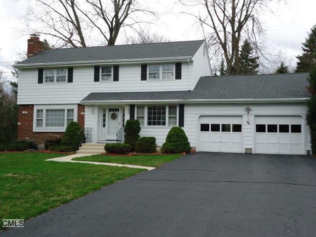 84 Haverhill Road Trumbull, CT 06611 - Photo 1 of 1 a front view of a house with a yard and garage