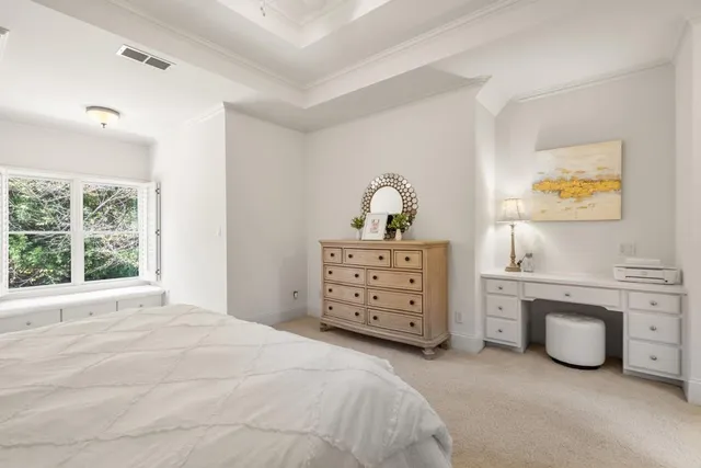a living room with furniture a table and kitchen view