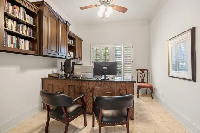an aerial view of a house with swimming pool and porch with furniture