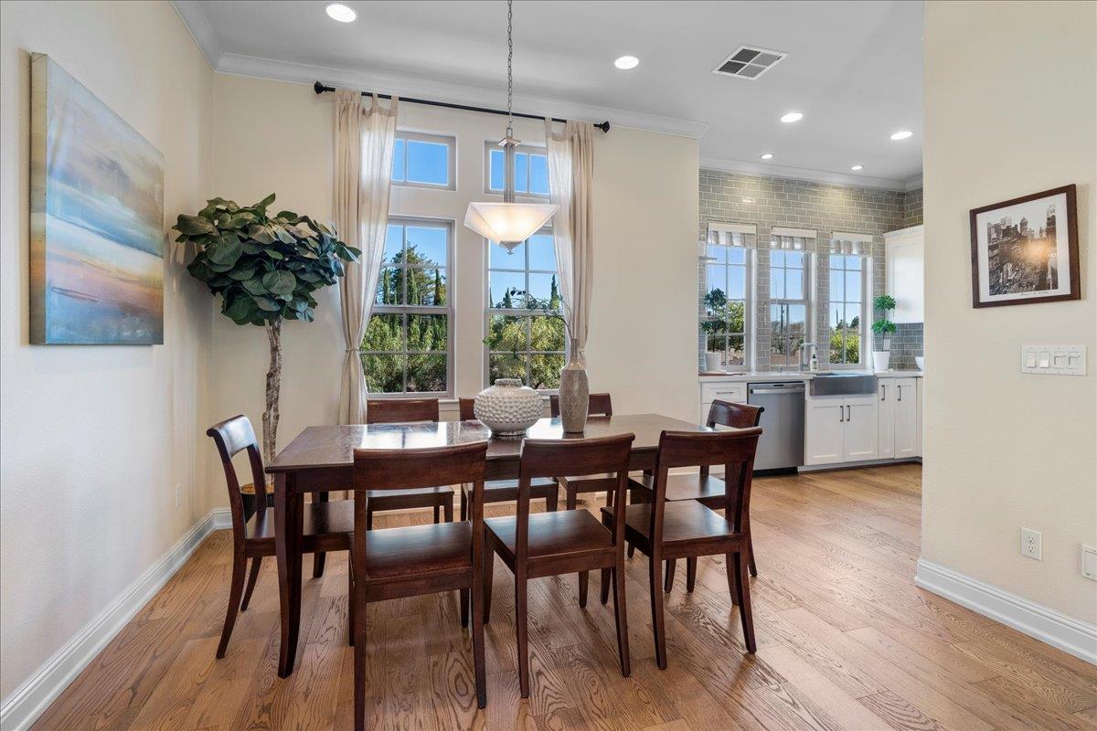 725 Reflection Way Mountain View, CA 94043 - Photo 13 of 39 a dining room with furniture and wooden floor