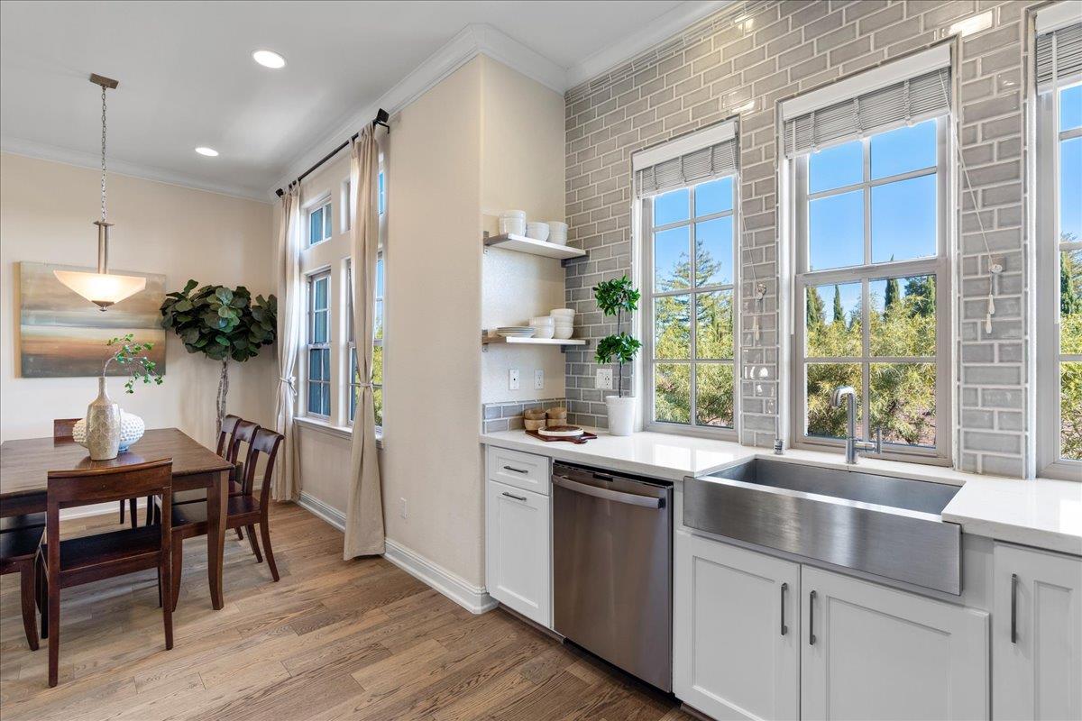 725 Reflection Way Mountain View, CA 94043 - Photo 18 of 39 a kitchen with a table chairs and refrigerator