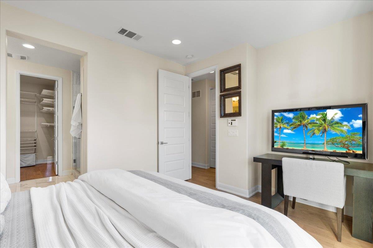 725 Reflection Way Mountain View, CA 94043 - Photo 26 of 39 a bedroom with a bed and a flat screen tv