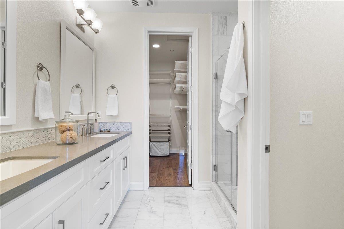 725 Reflection Way Mountain View, CA 94043 - Photo 27 of 39 a spacious bathroom with a granite countertop sink a mirror and a shower