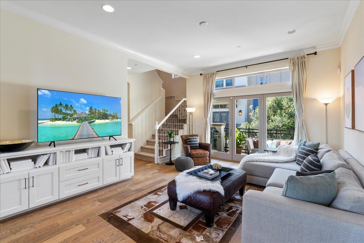 725 Reflection Way Mountain View, CA 94043 - Photo 7 of 39 a living room with furniture a large window with kitchen view