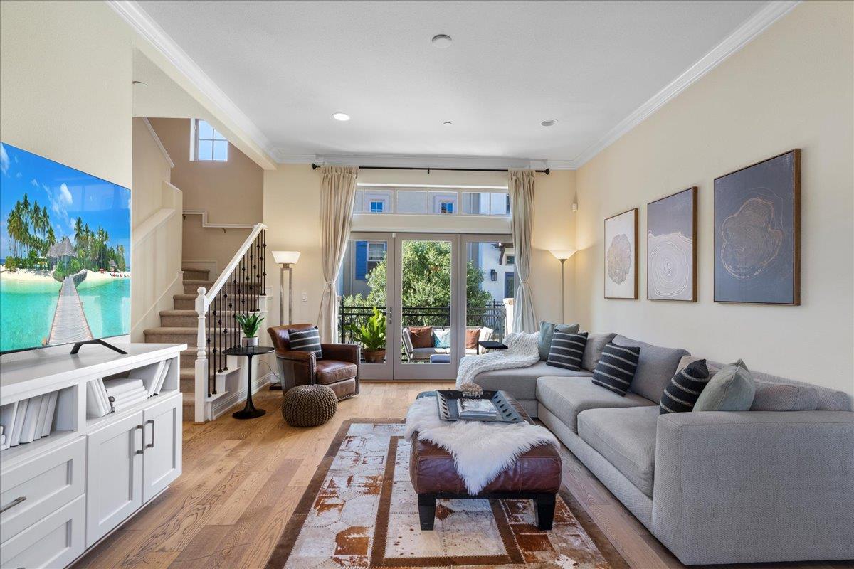 725 Reflection Way Mountain View, CA 94043 - Photo 9 of 39 a living room with furniture wooden floor and a large window