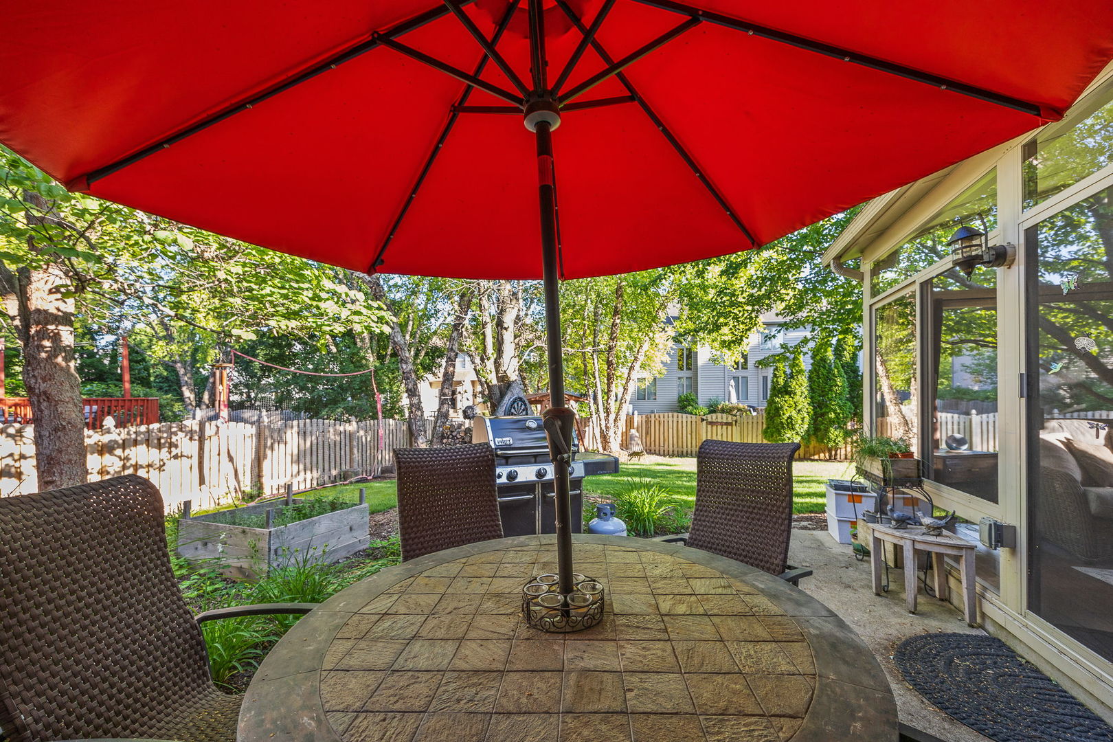 2816 Cordgrass Road Naperville, IL 60564 - Photo 37 of 49 a view of patio with couches table and chairs under an umbrella