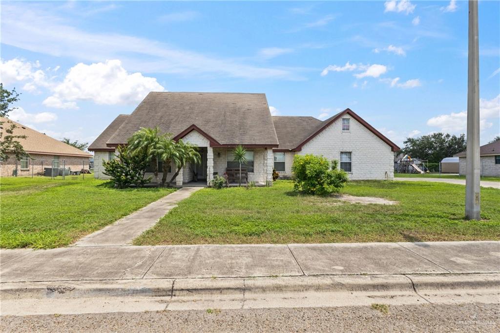 402 Mockingbird Lane Edcouch, TX 78538 - Photo 1 of 25 White brick exterior featuring a covered entry