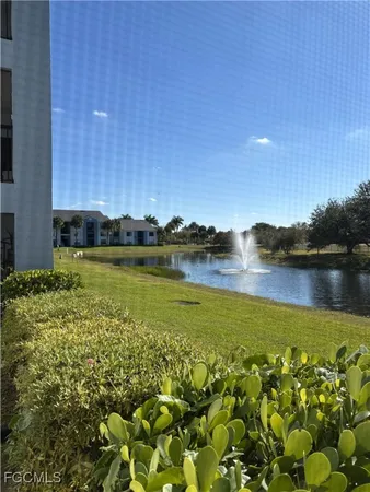a view of a lake with a building in the background