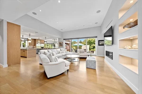 a living room with fireplace furniture and a flat screen tv