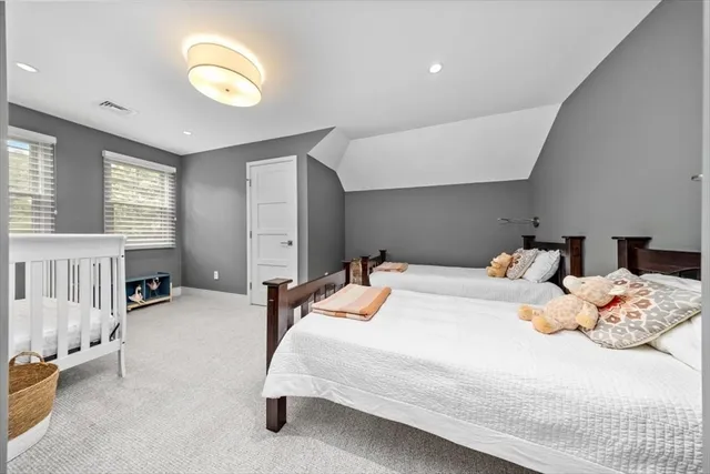 a bedroom with bed and a night stand