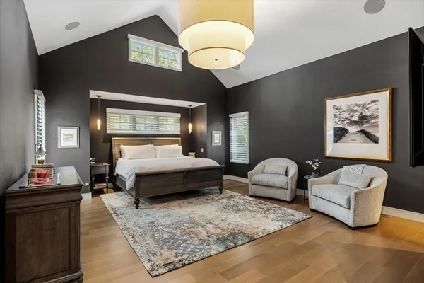 a bedroom with bed and window