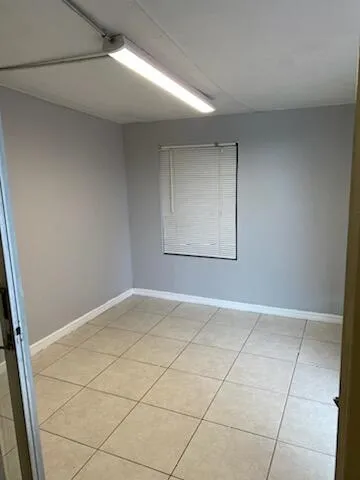 a view of an empty room and a window