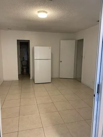 an empty room with a bathroom