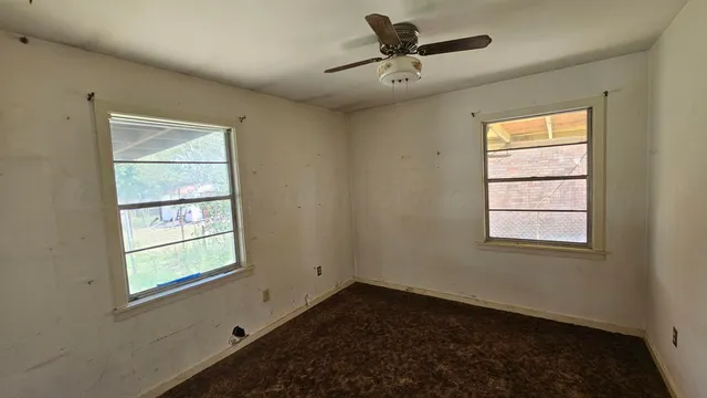 a view of an empty room and window