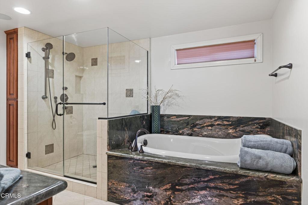 2408 Ocean Drive Oxnard, CA 93035 - Photo 24 of 58 a bathroom with a bathtub and shower