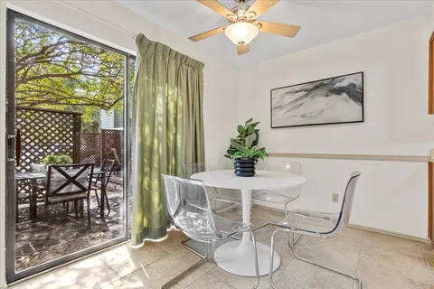 a dining room with furniture and window