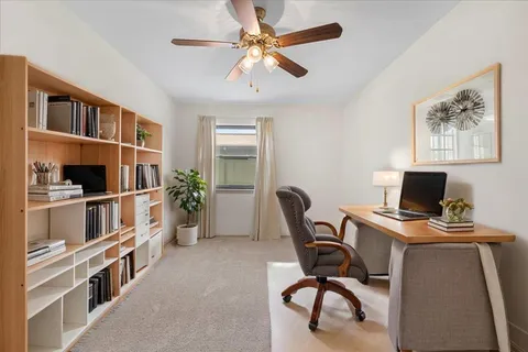 a view of a workspace with furniture