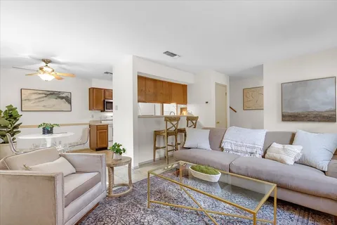 a living room with furniture and a large window