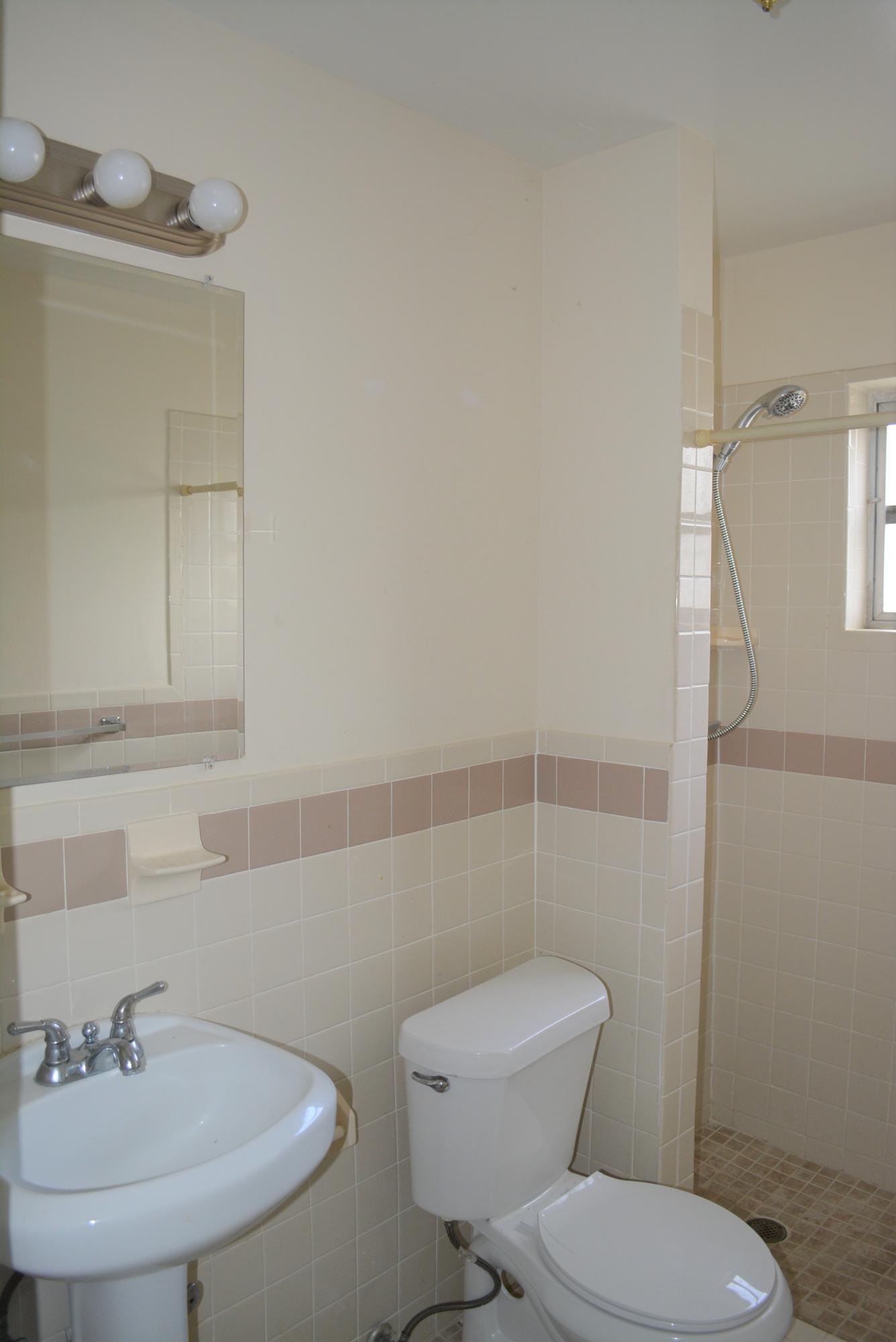 28520 Southwest 146th Avenue Homestead, FL 33033 - Photo 11 of 23 a bathroom with a toilet a sink and mirror