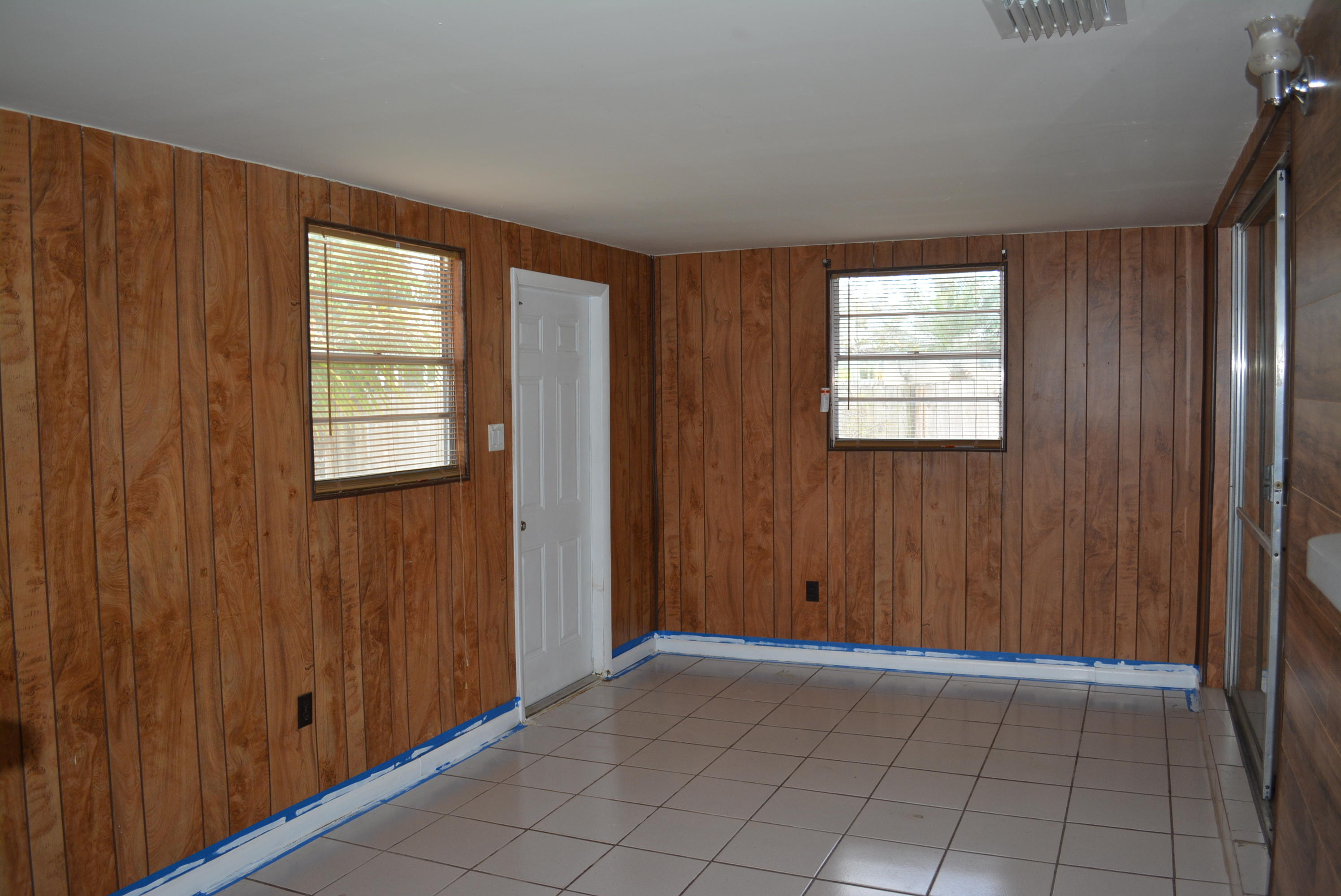 28520 Southwest 146th Avenue Homestead, FL 33033 - Photo 16 of 23 an empty room with windows
