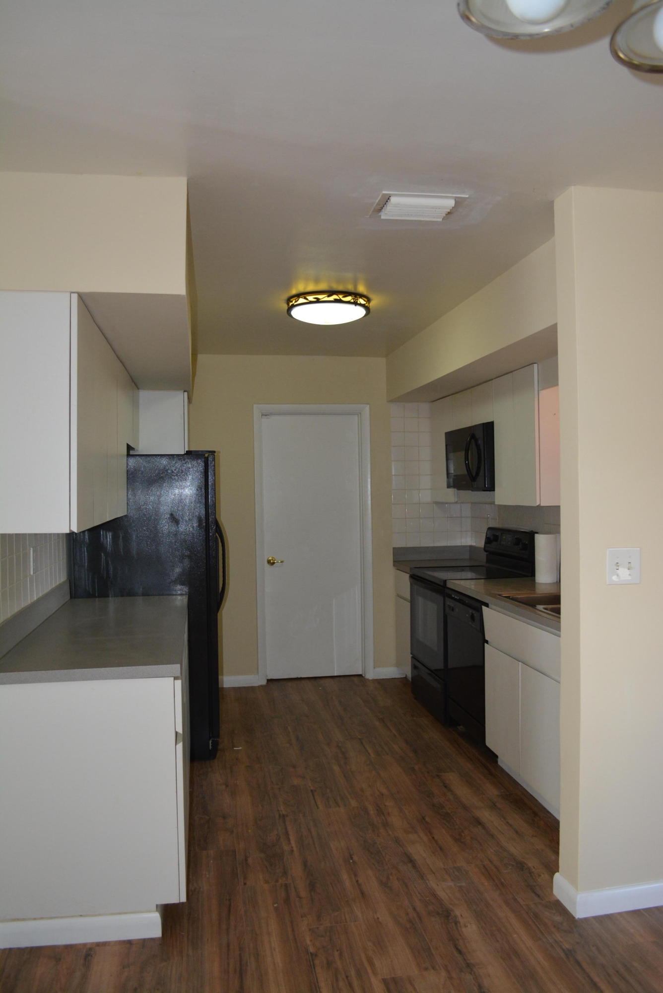 28520 Southwest 146th Avenue Homestead, FL 33033 - Photo 17 of 23 a kitchen with a sink and a stove top oven