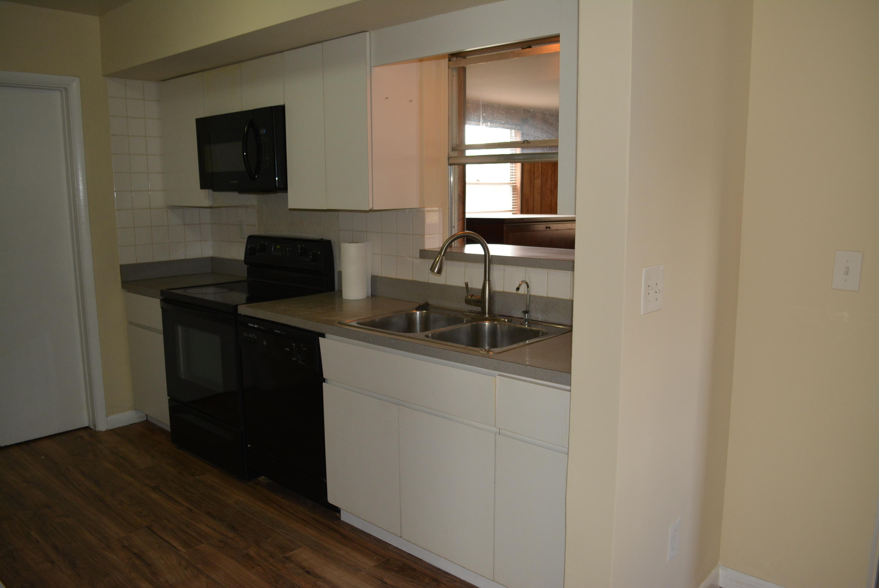 28520 Southwest 146th Avenue Homestead, FL 33033 - Photo 19 of 23 a kitchen with a sink and a microwave