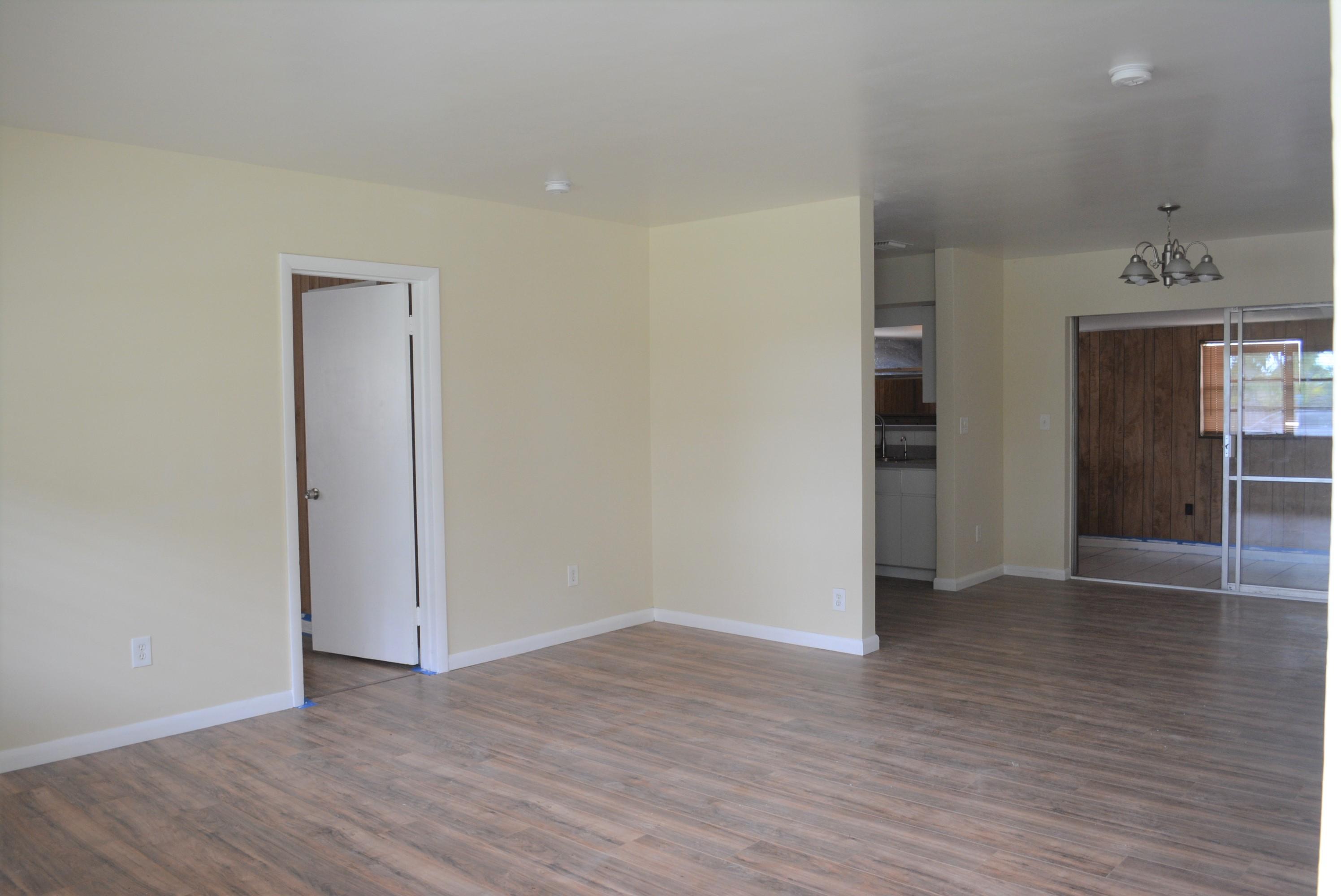 28520 Southwest 146th Avenue Homestead, FL 33033 - Photo 3 of 23 an empty room with wooden floor and closet