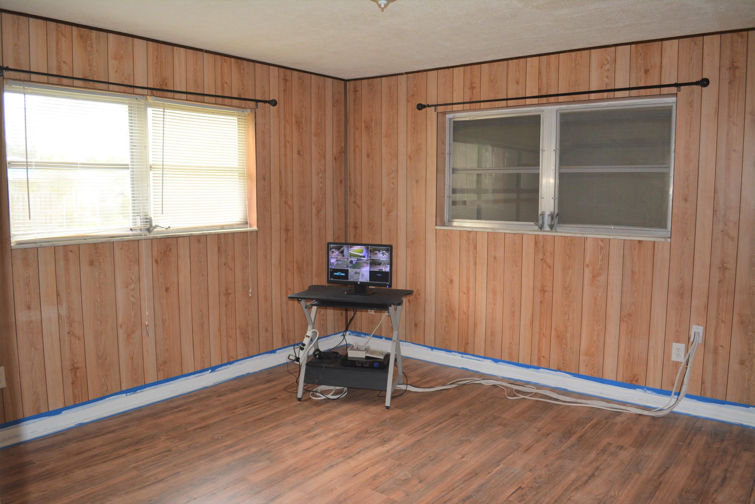 28520 Southwest 146th Avenue Homestead, FL 33033 - Photo 6 of 23 a view of a livingroom with wooden floor and a window